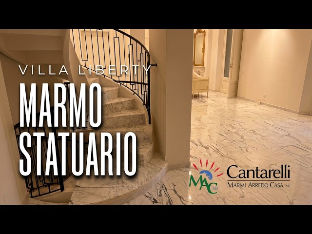 Pavimenti e scala in marmo Statuario in una villa Liberty